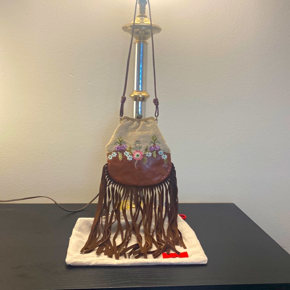 Vintage Valentino decorative purse with long strap.